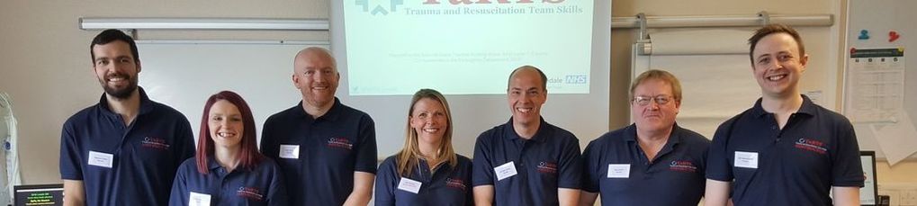 Trauma and resuscitation team skills trainers standing next to each other