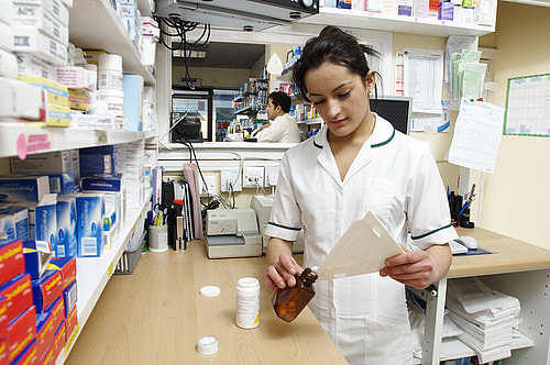 Photo. Pharmacy Technician working in a dispensary.